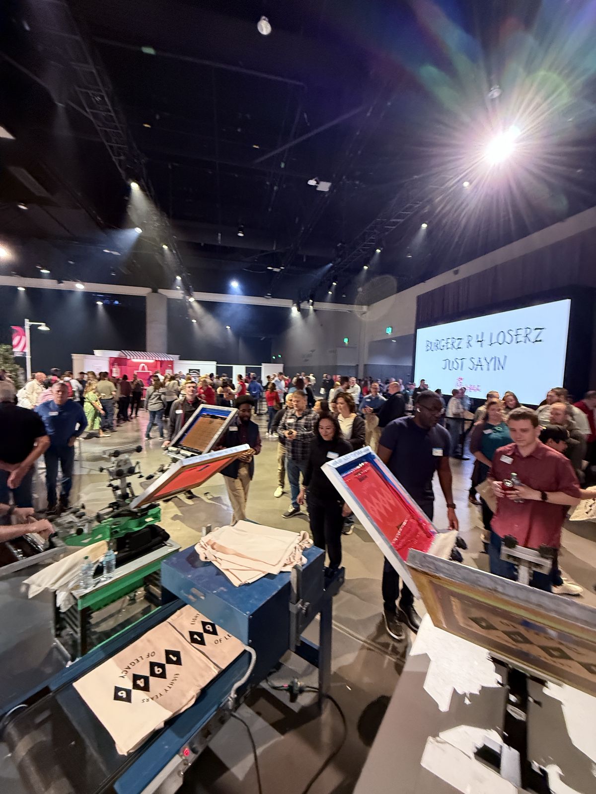 Merch Troop live printing — fresh prints off the platen